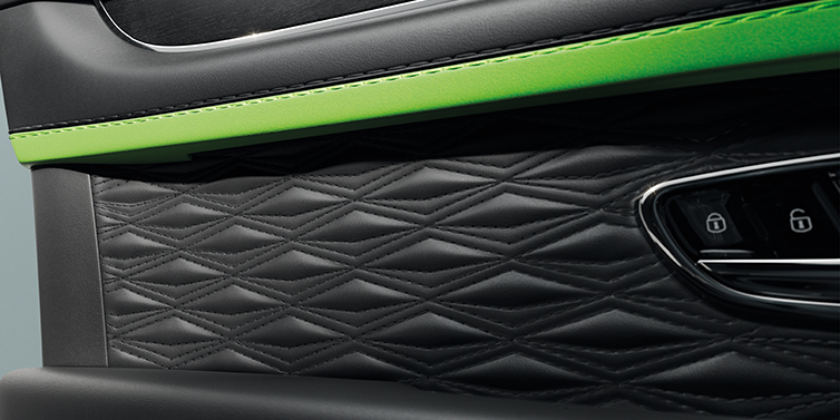 Bentley Tel Aviv Bentley Bentayga Speed SUV interior door detail with Diamond in Diamond stitched hide in Beluga black colour, with Black stained Crown Cut Walnut veneer