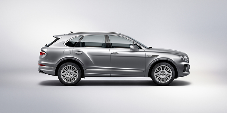 Bentley Tel Aviv Bentley Bentayga SUV side profile in Moonbeam silver paint against white background featuring 21 inch 5 spoke wheels
