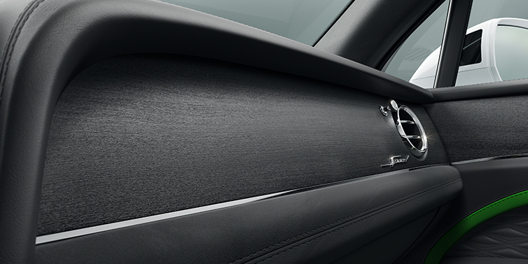 Bentley Tel Aviv Bentley Bentayga Speed SUV front dash close up in Hyper Green and Beluga black hides, with Black Stained Crown Cut Walnut veneer