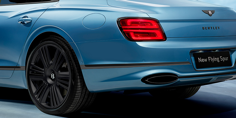 Bentley Tel Aviv New Bentley Flying Spur Azure sedan in Light windsor blue by Mulliner paint and Black Specification, showing 22 inch Black Azure wheel, black exhaust pipes and exterior features