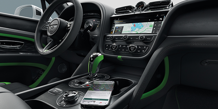 Bentley Tel Aviv Bentley Bentayga Speed SUV front cabin in Hyper Green and Beluga black hides, with Black Stained Crown Cut Walnut veneer
