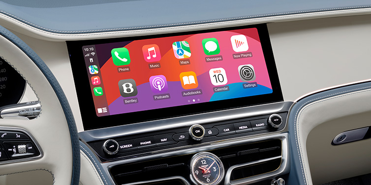 Bentley Tel Aviv New Bentley Flying Spur Azure sedan front cabin central MMI screen showing available services against Linen and Brunel hides and Piano Linen veneer