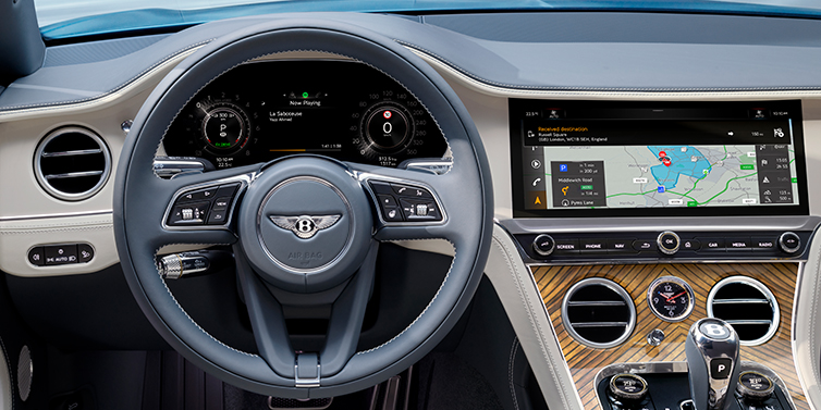 Bentley Tel Aviv New Bentley Continental GT Azure coupe front interior in Linen and Brunel blue hides, showing steering wheel and driver's instruments